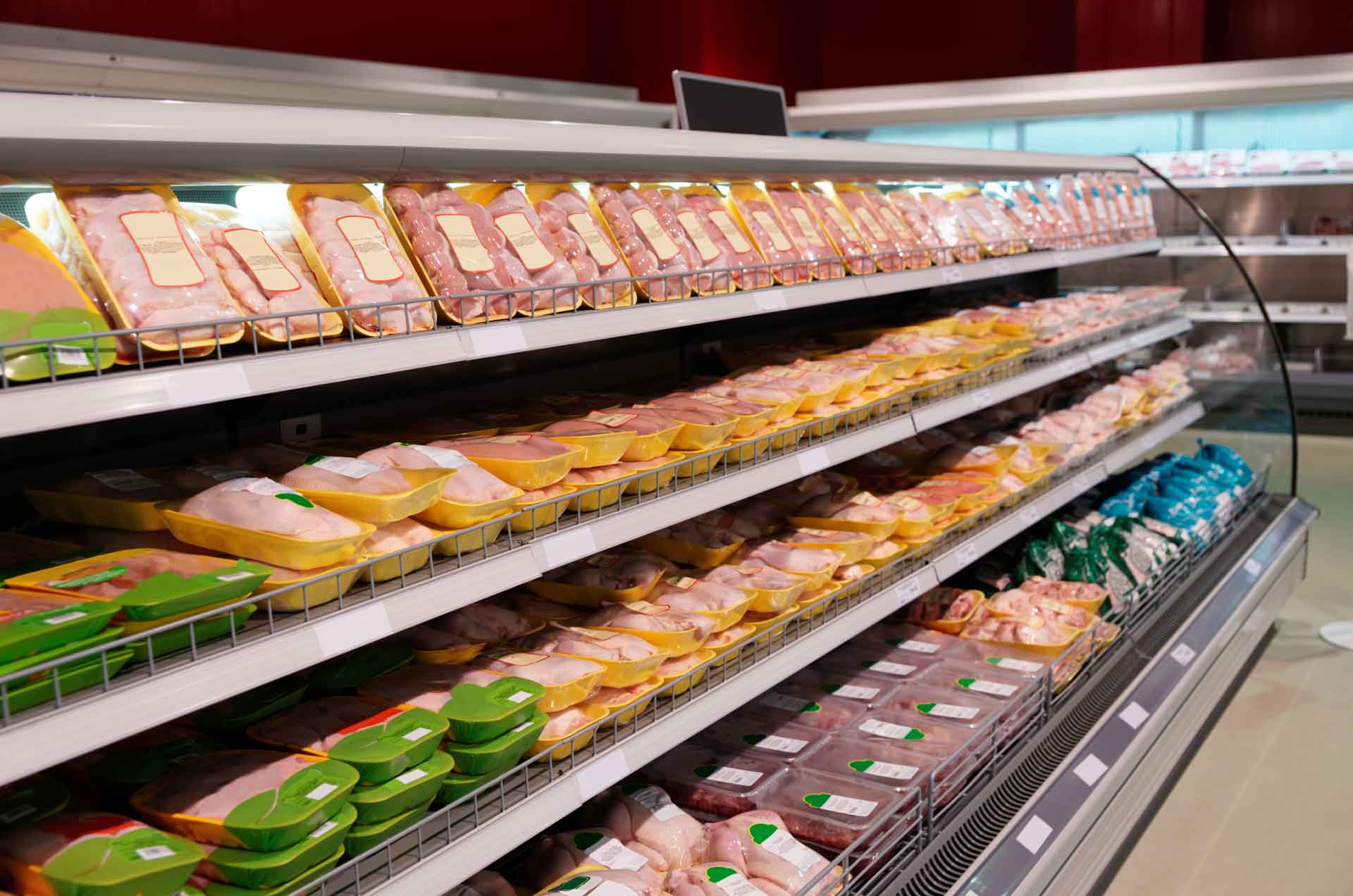 Fresh chicken meat on supermarket shelf 