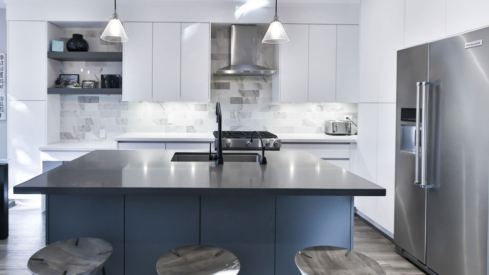 Kitchen with large KitchenAid refrigerator and bold modern decor
